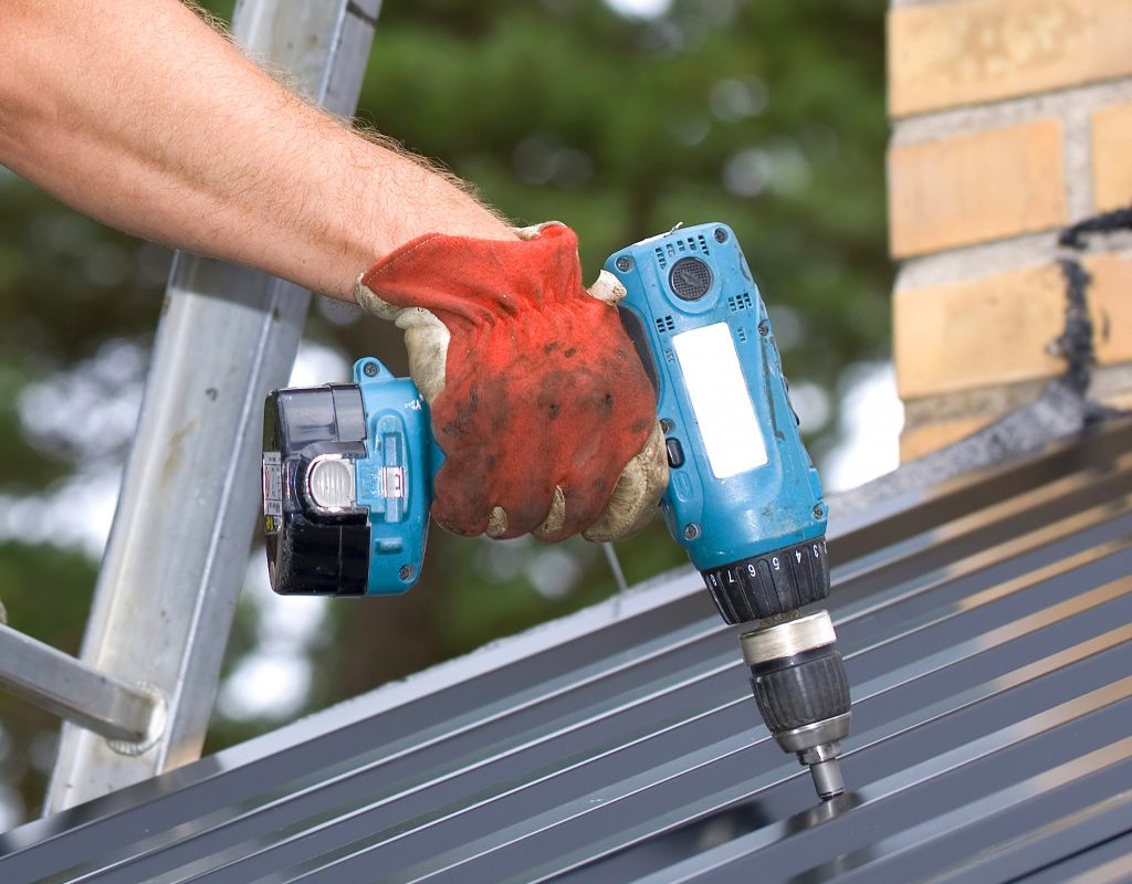 Working with a Power drill on a roof