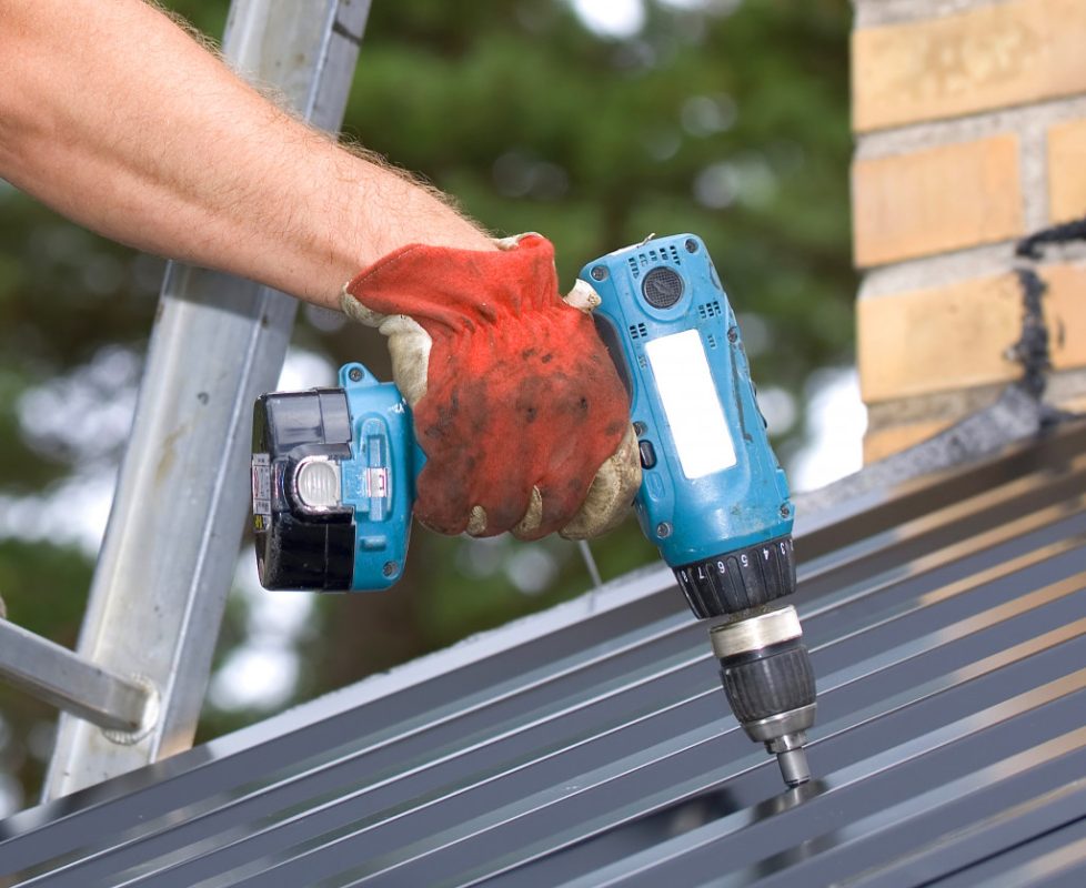 Working with a Power drill on a roof