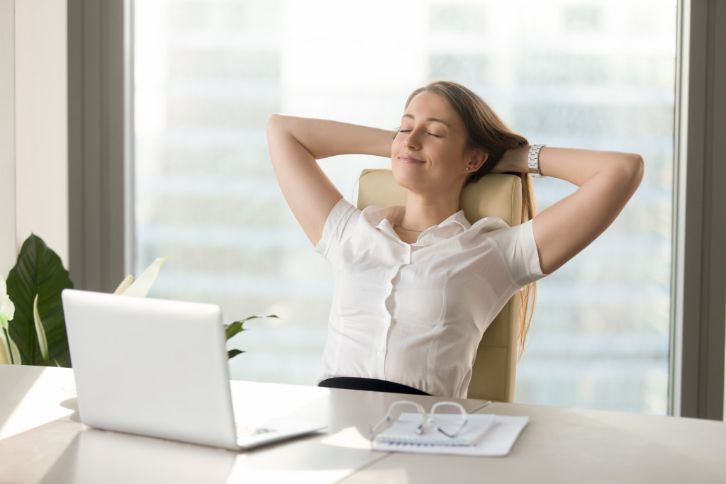 woman relaxing in her seat during work hours